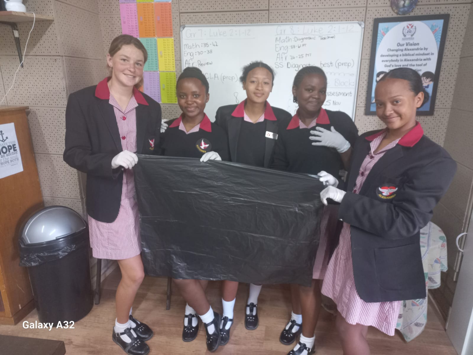 Sume Bakkes, Azole Hobongwane, Enlin Wentzel, Akhile Cengani, and Kate-Lynn Cannon preparing for the clean-up initiative.