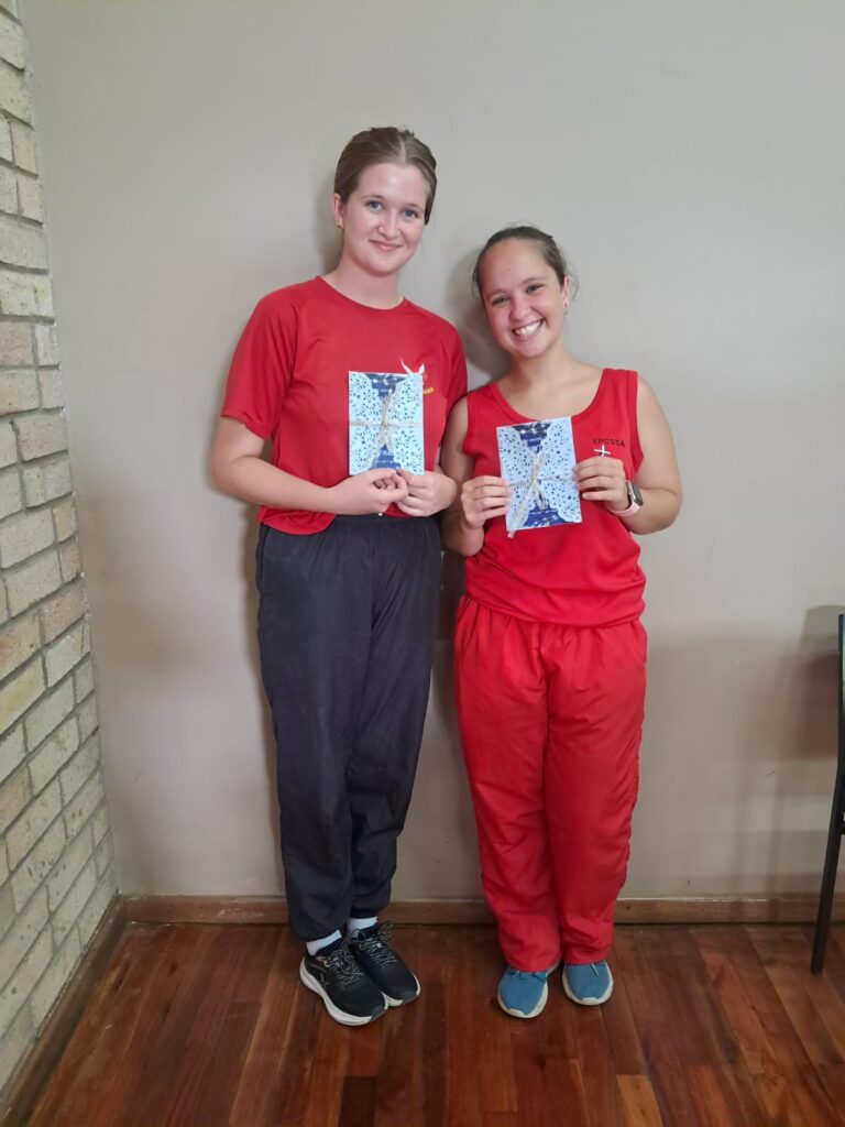 2026 matriculants Anke Bosman and Mia Schutte happily receiving their invitations to the Matric Dance