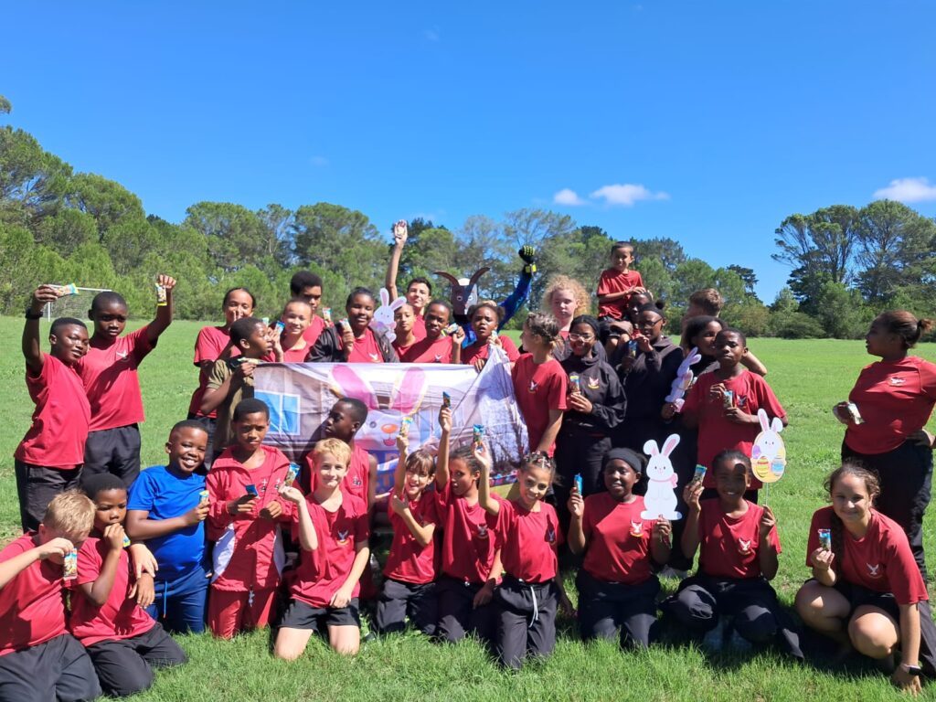 Learners receiving Easter eggs at the end of the hunt.