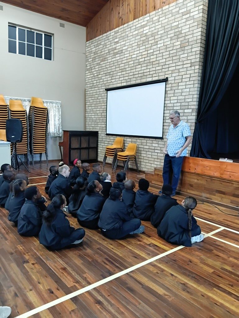 Pastor Leon sharing words of encouragement with learners.