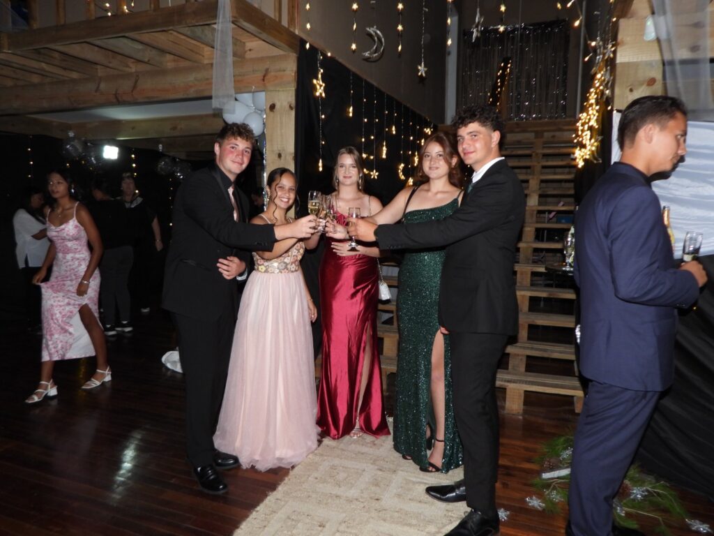 Learners share a toast during the school formal event.