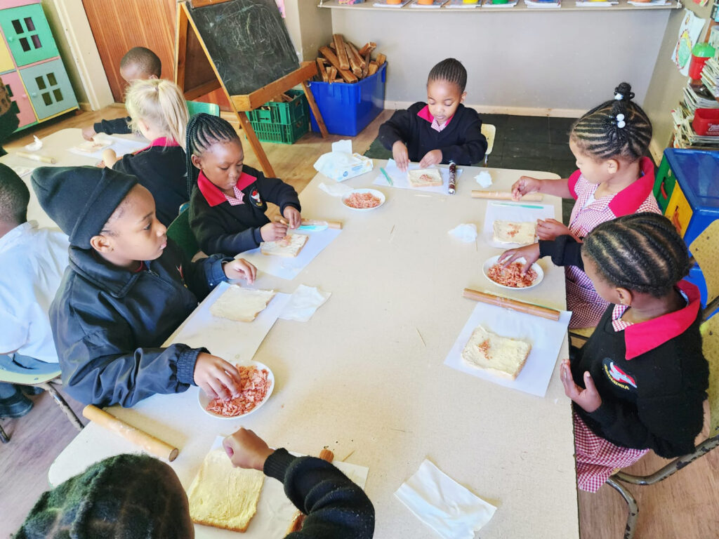 Grade R learners enjoying their morning “Bak en Brou” activity.