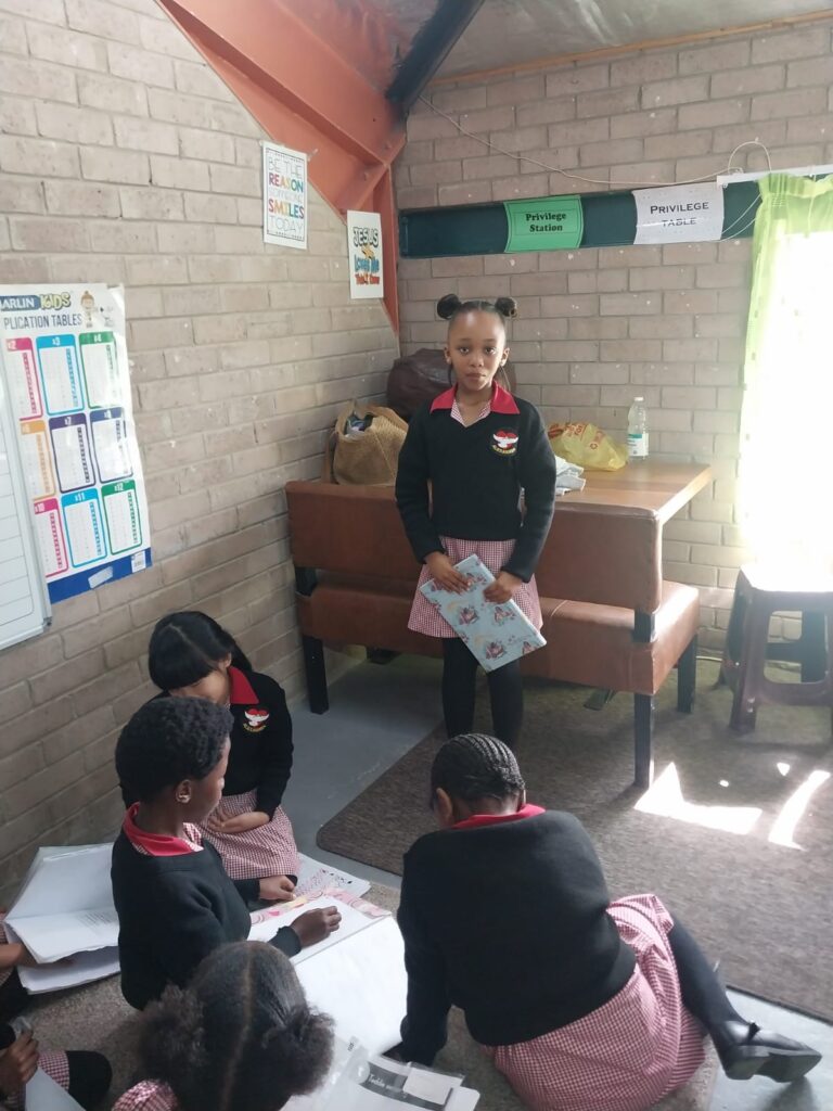Imivuyo Witbooi explains her story as part of the Grade 3 book report.
