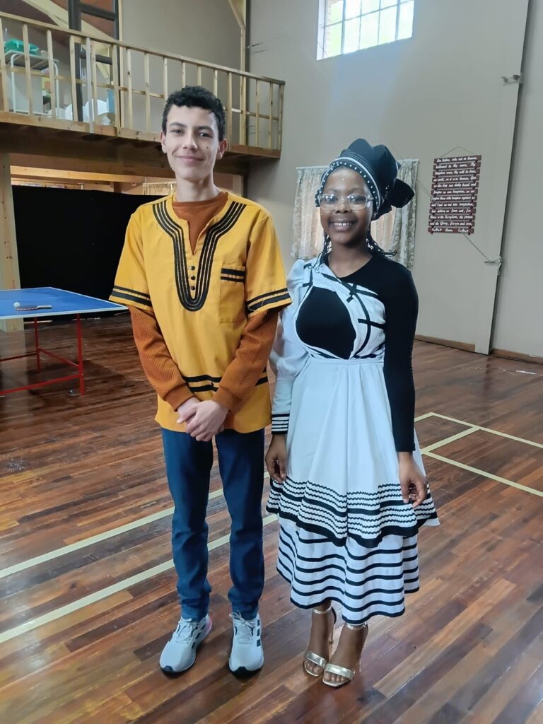 Michiano Coltman and Olwenene Penze proudly dressed in traditional Xhosa attire.