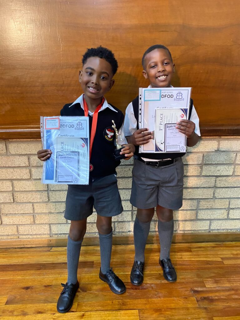Kaleab Abraham and Licebo Potgieter proudly celebrating their achievements at the Alexandria Christian Academy Gala Awards.