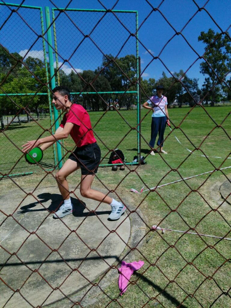 Michiano Coltman in action during the discus event, where he secured fifth place.